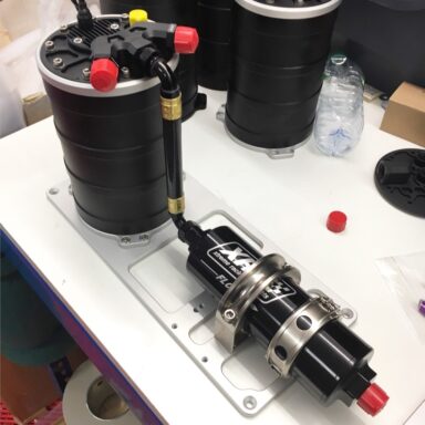 Getting ready for its debut, the XRP Protec pressurized surge tank with Brushless Screw Fuel Pump inside and quick release Clamshell external outlet filter