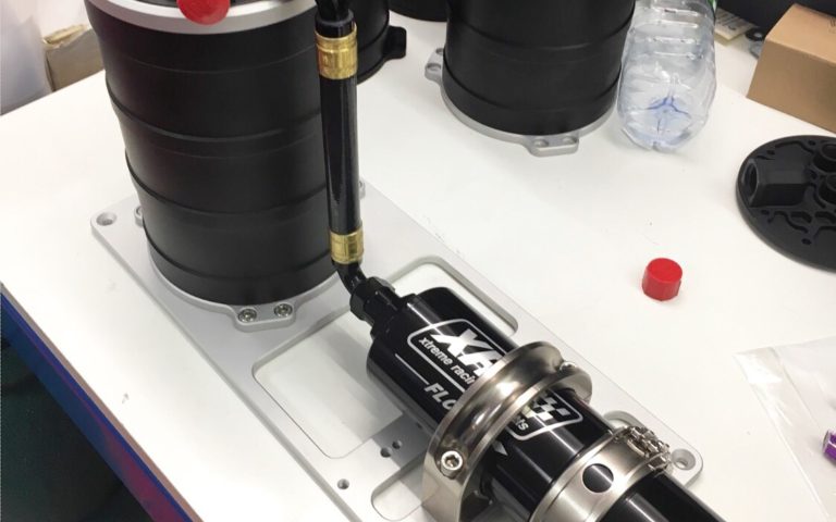 Getting ready for its debut, the XRP Protec pressurized surge tank with Brushless Screw Fuel Pump inside and quick release Clamshell external outlet filter